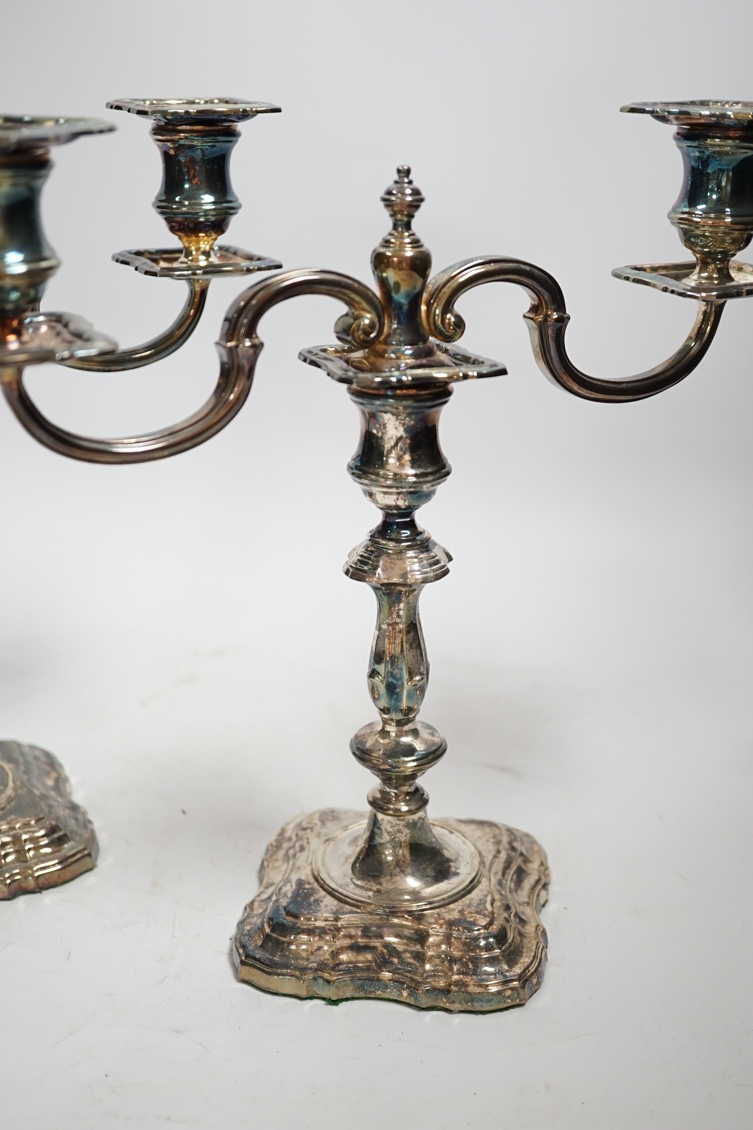 A modern pair of silver two branch, two light candelabra, C.J. Vander Ltd, London, 2000, height 25cm, weighable silver 36oz.